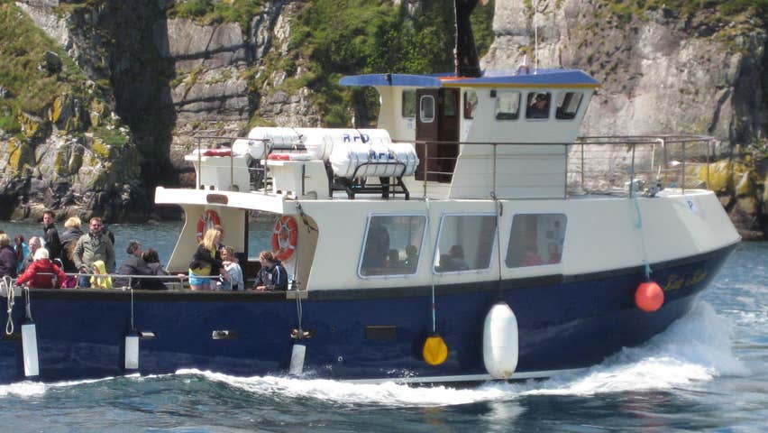 A boat at sea with passengers onboard