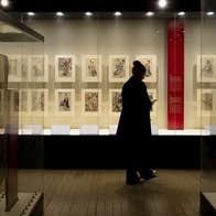 Image of a visitor exploring 'A Dubliner’s Collection of Asian Art: The Albert Bender Collection'