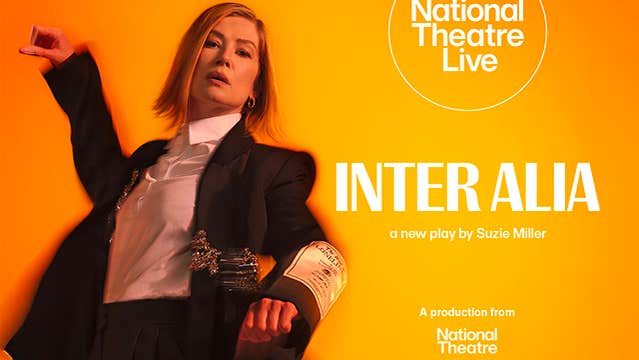 A woman in dark suit and white shirt is moving, slightly blurred, against orange background.