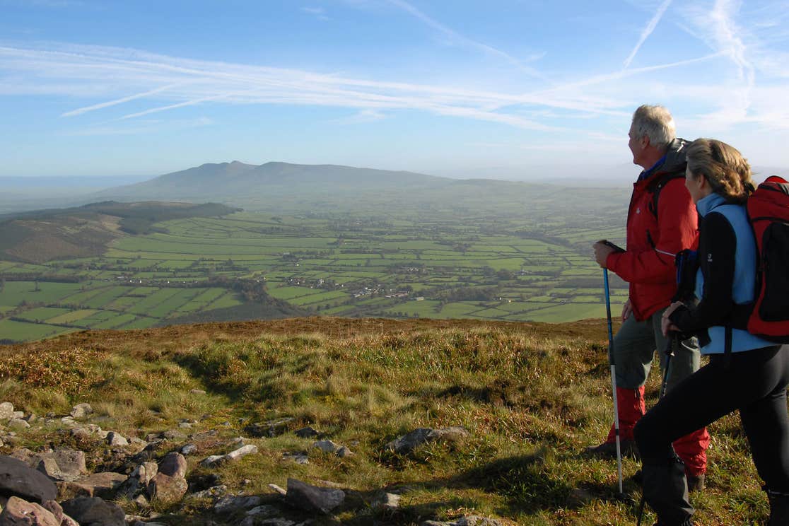 Two people in hiking gear walking Blackrock Loop, Ballyhoura, County Limerick