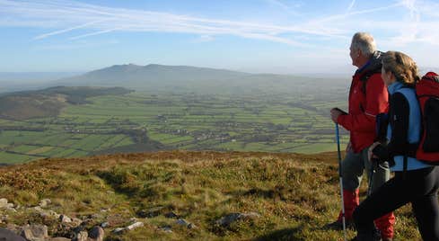 Two people in hiking gear walking Blackrock Loop, Ballyhoura, County Limerick