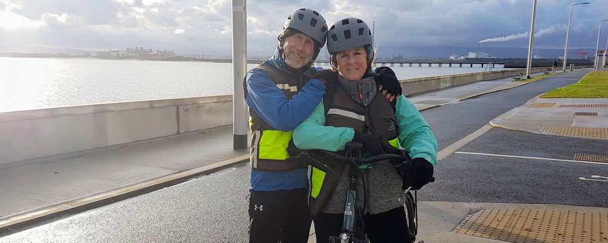 Cyclist couple on the seafront