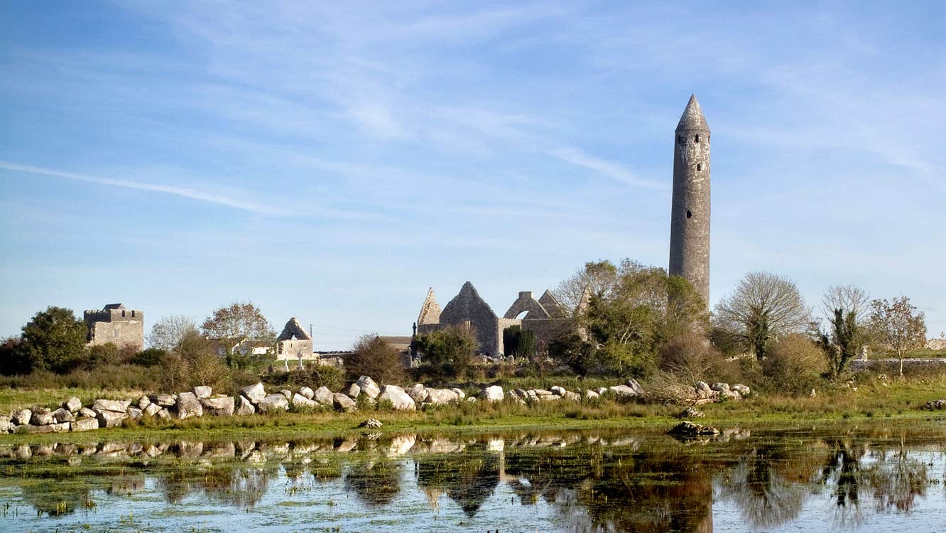 Round tower and churches at Kilmacduagh Monastic Site, County Galway