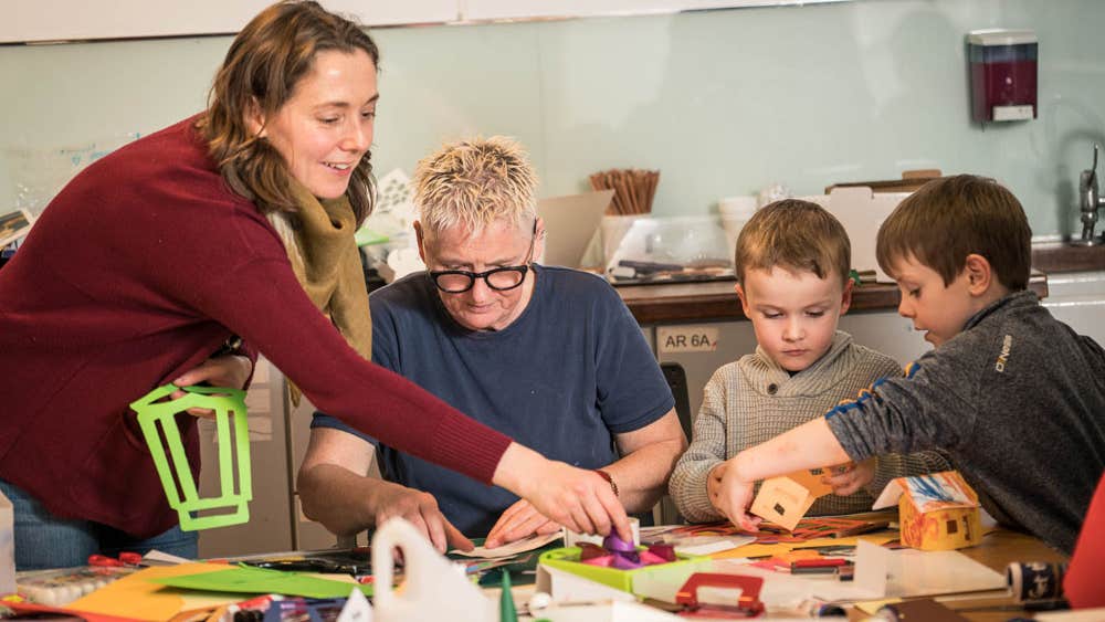 A family engaging in arts and crafts at the Museum