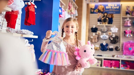 A girl with pink teddy and clothing