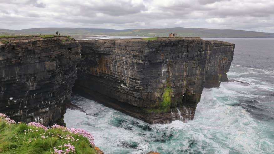 People walking at Downpatrick Head in Mayo