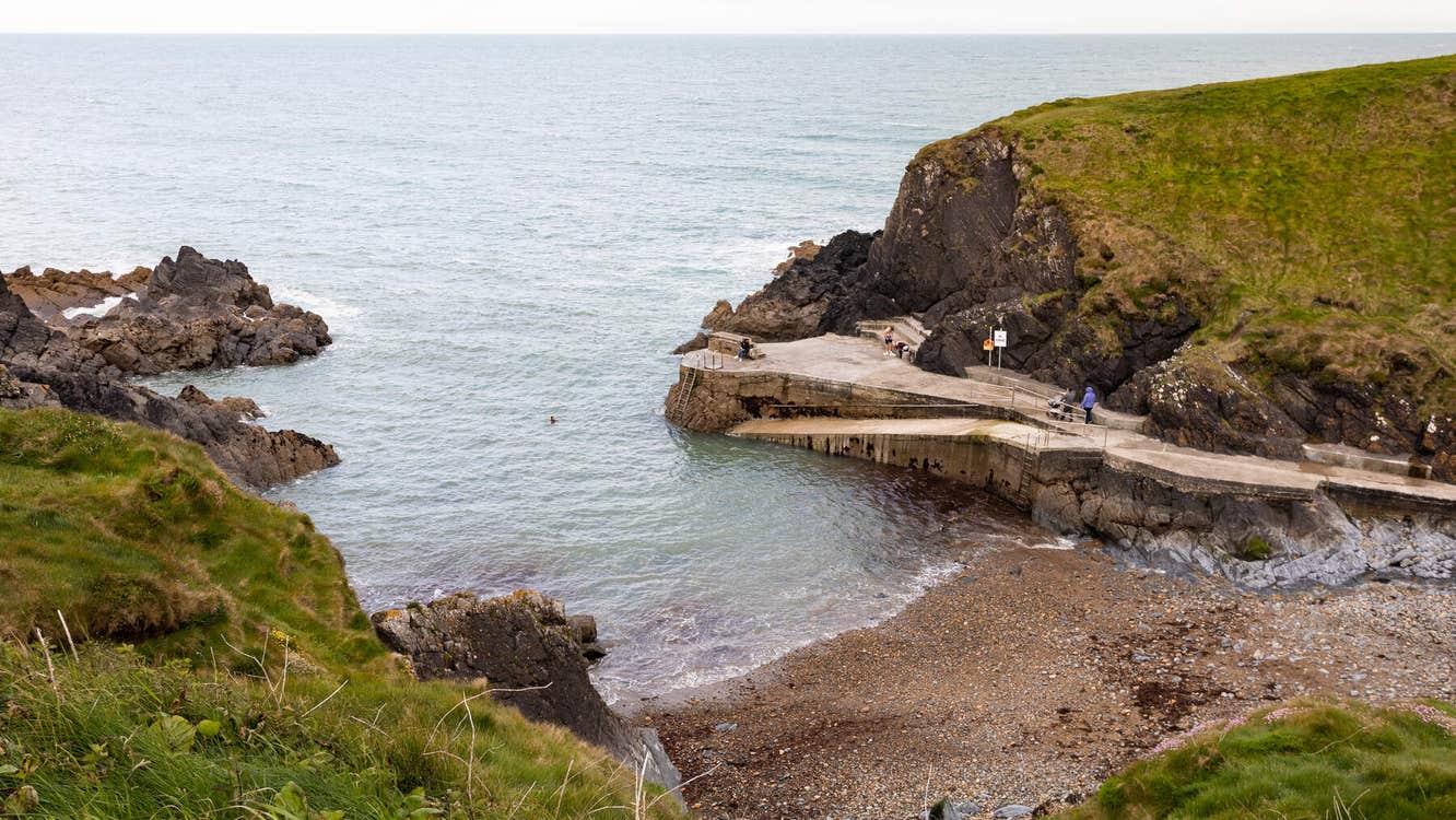 Looking down on a cove with a pier