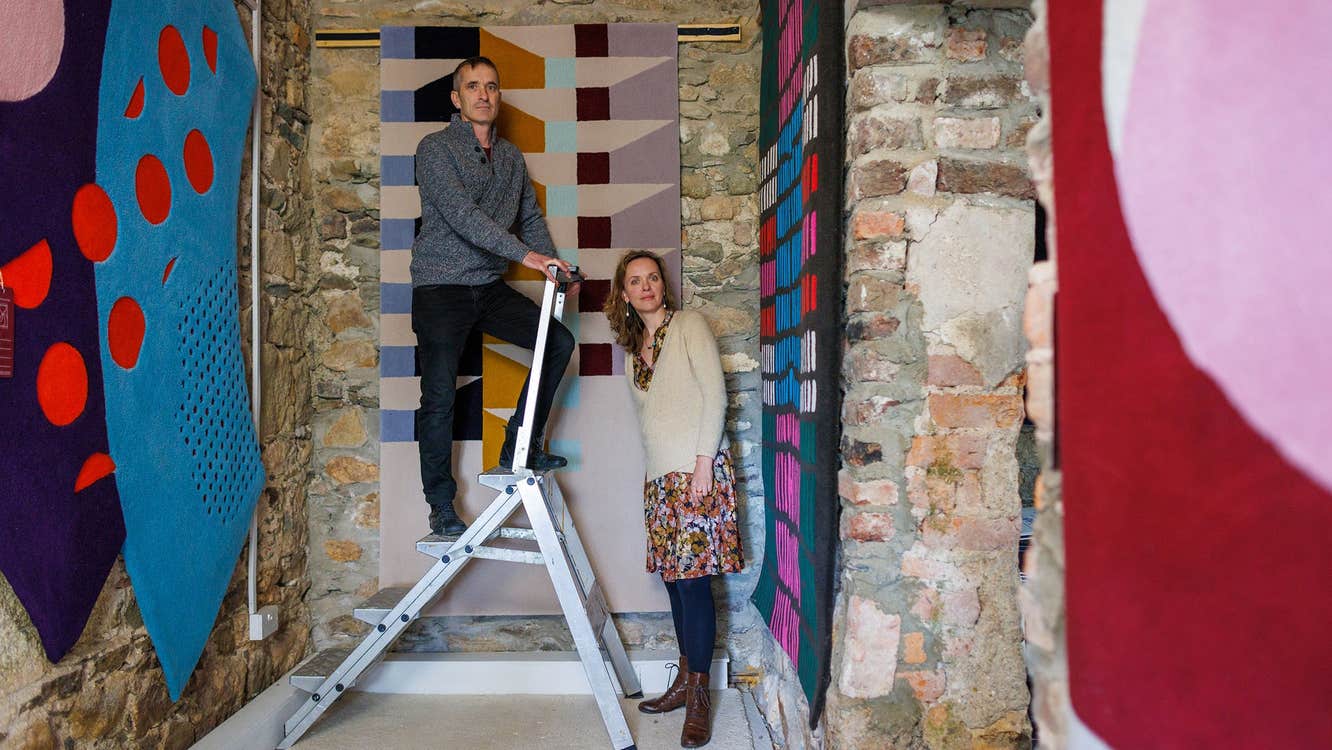 A selection of wall hangings on display by Ceadogán Rugmakers