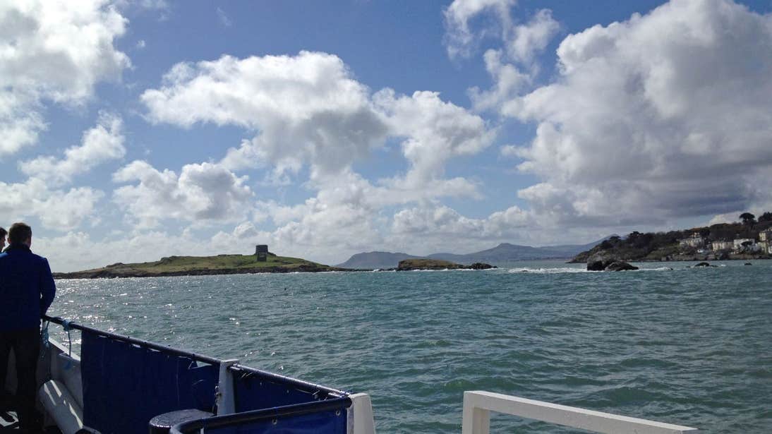 People looking out at Dalkey Island from aboard a Dublin Bay Cruises boat trip