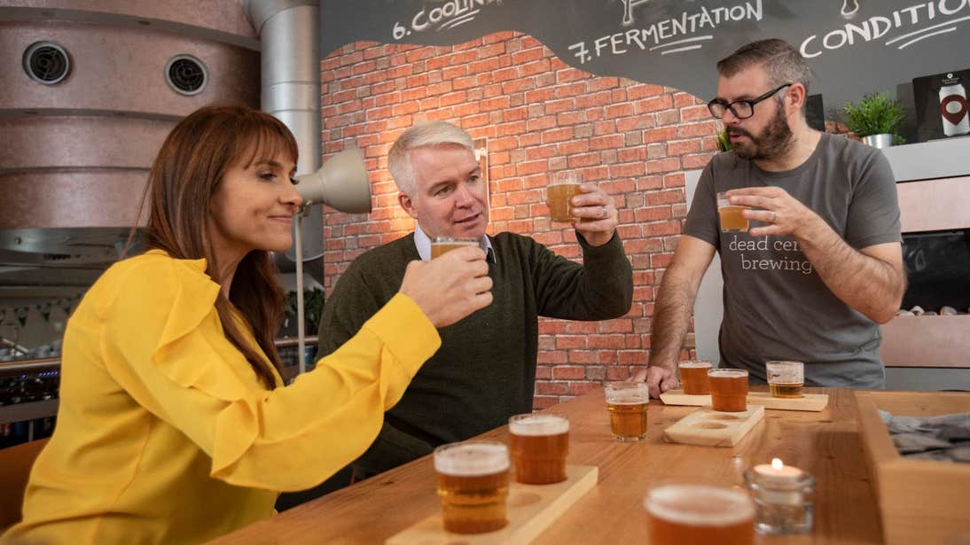 A brewer leading a guiding tasting for two people in Dead Centre Brewing, Athlone, Westmeath