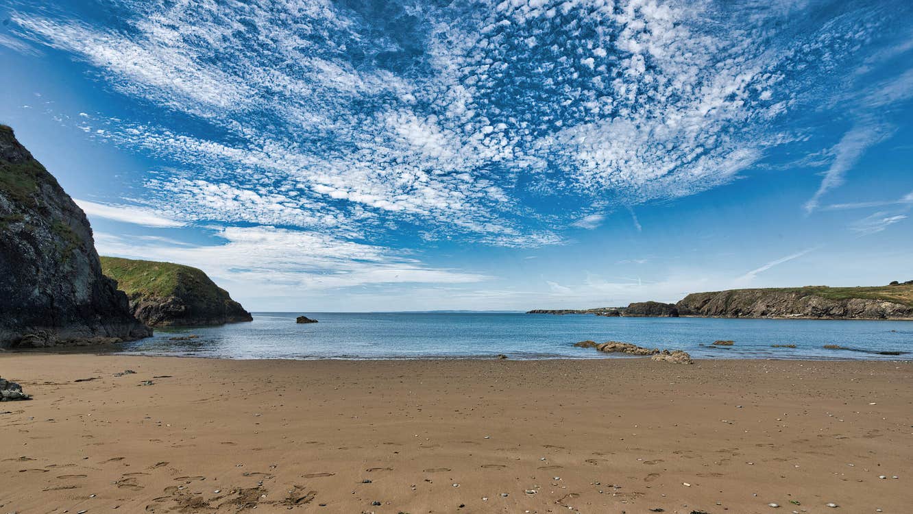 Beach with the sea and dramatic sky