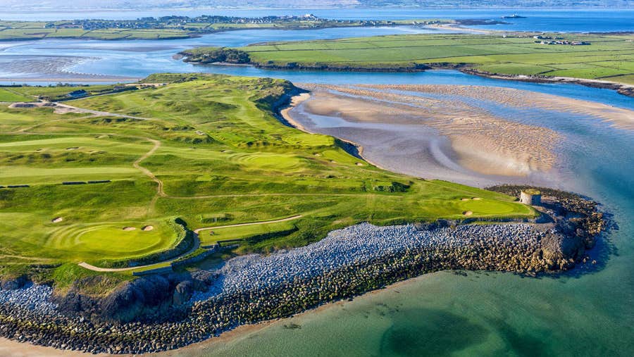 An aerial view of Tralee Golf Club golf course and surrounding coastal scenery