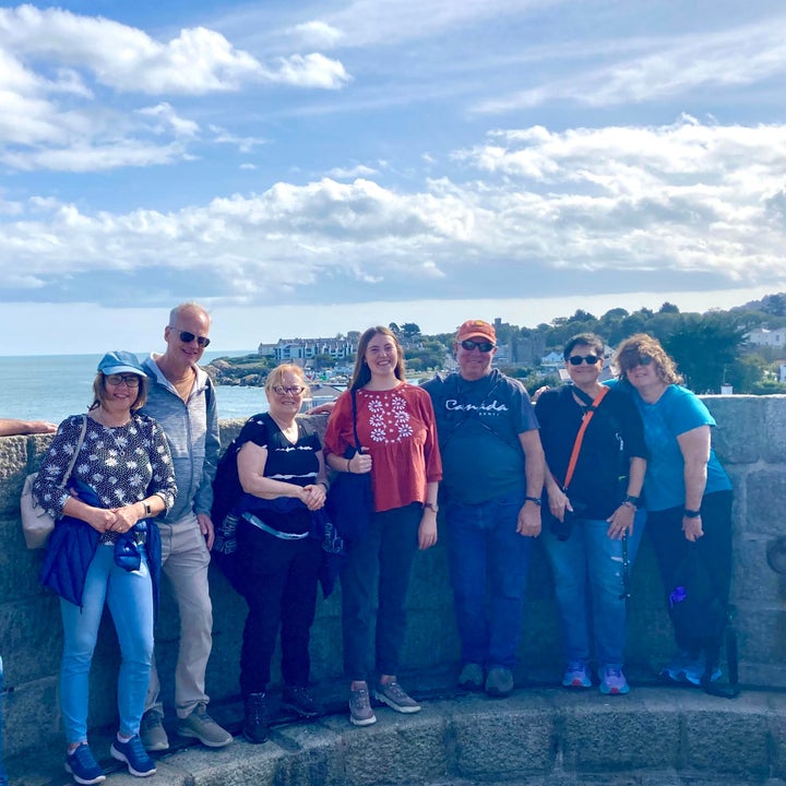 A group of people with their tour guide on a Dublin Coastal Tour