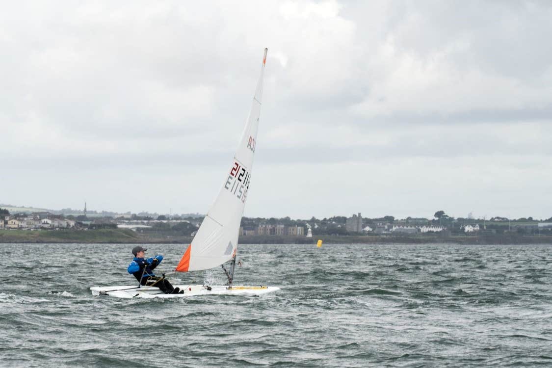 A boy sailing out on the water with Wexford Harbour Boat and Tennis Club