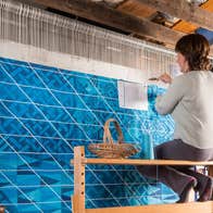 Áine Dunne hand weaving a specially commissioned piece for LinkedIn in her design studio