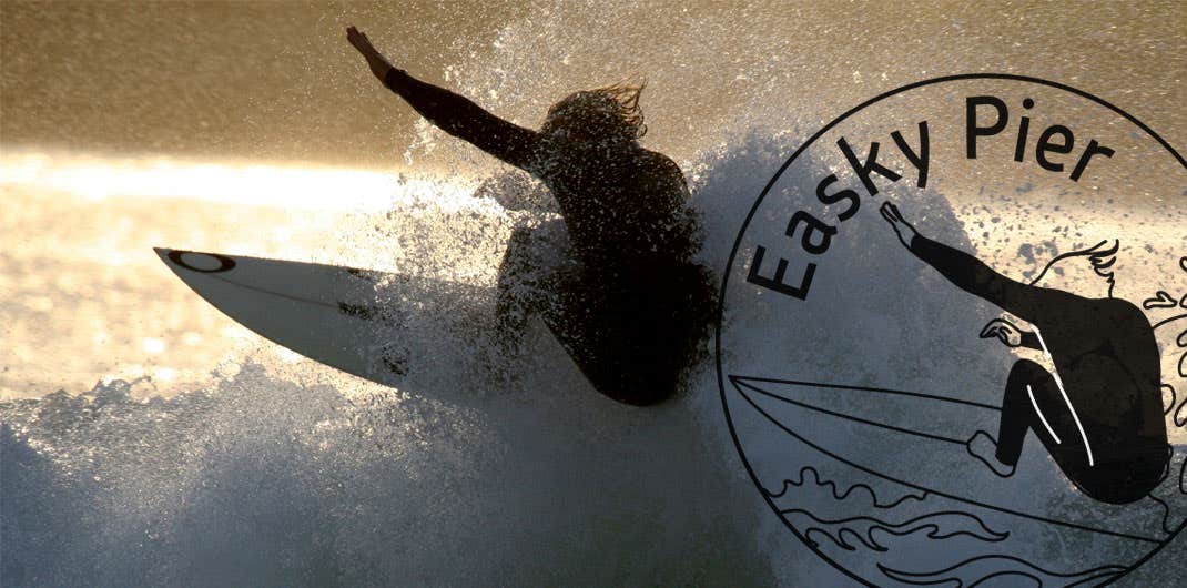 Surfer in Easky Pier with the Easky Pier Wild Atlantic Way Passport stamp