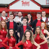 Taylors Three Rock resident band and dancers outside Taylors Three Rock