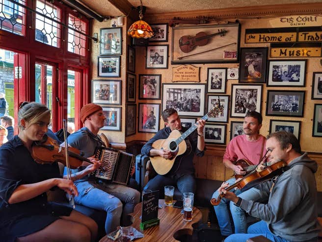 Five trad musicians playing in Tig Cóilí pub in Galway city.