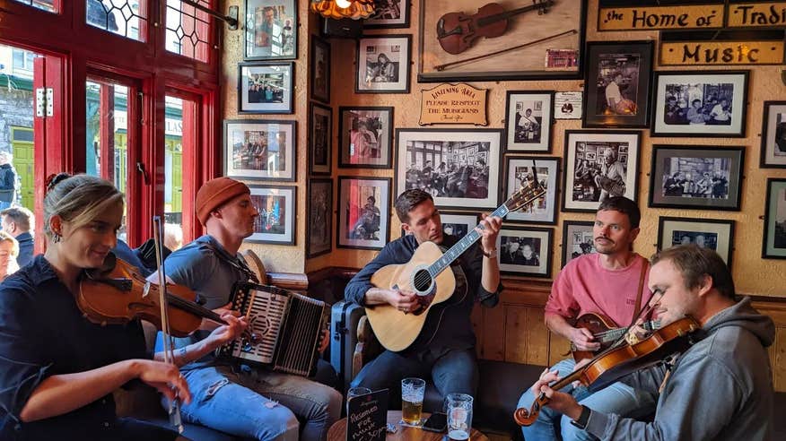 Five trad musicians playing in Tig Cóilí pub in Galway city.