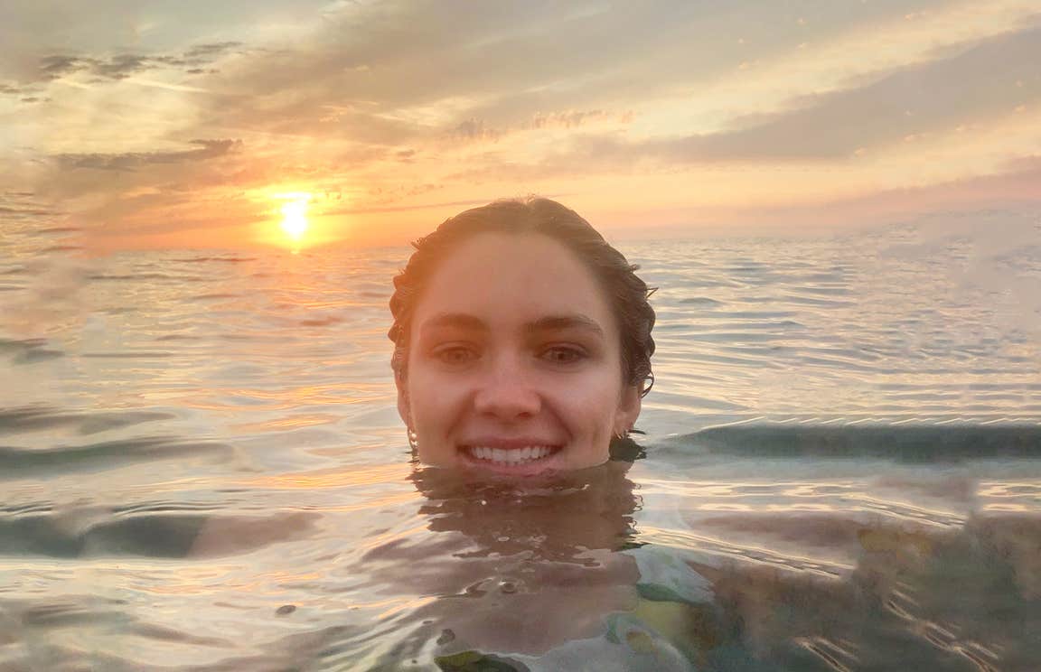 Niamh Cullen swimming at sunset