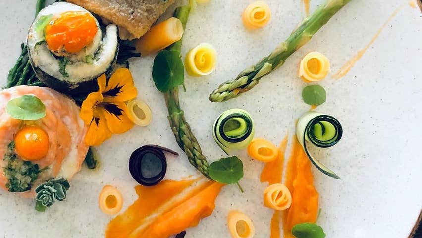 A tasty plate of seafood and sushi rolls