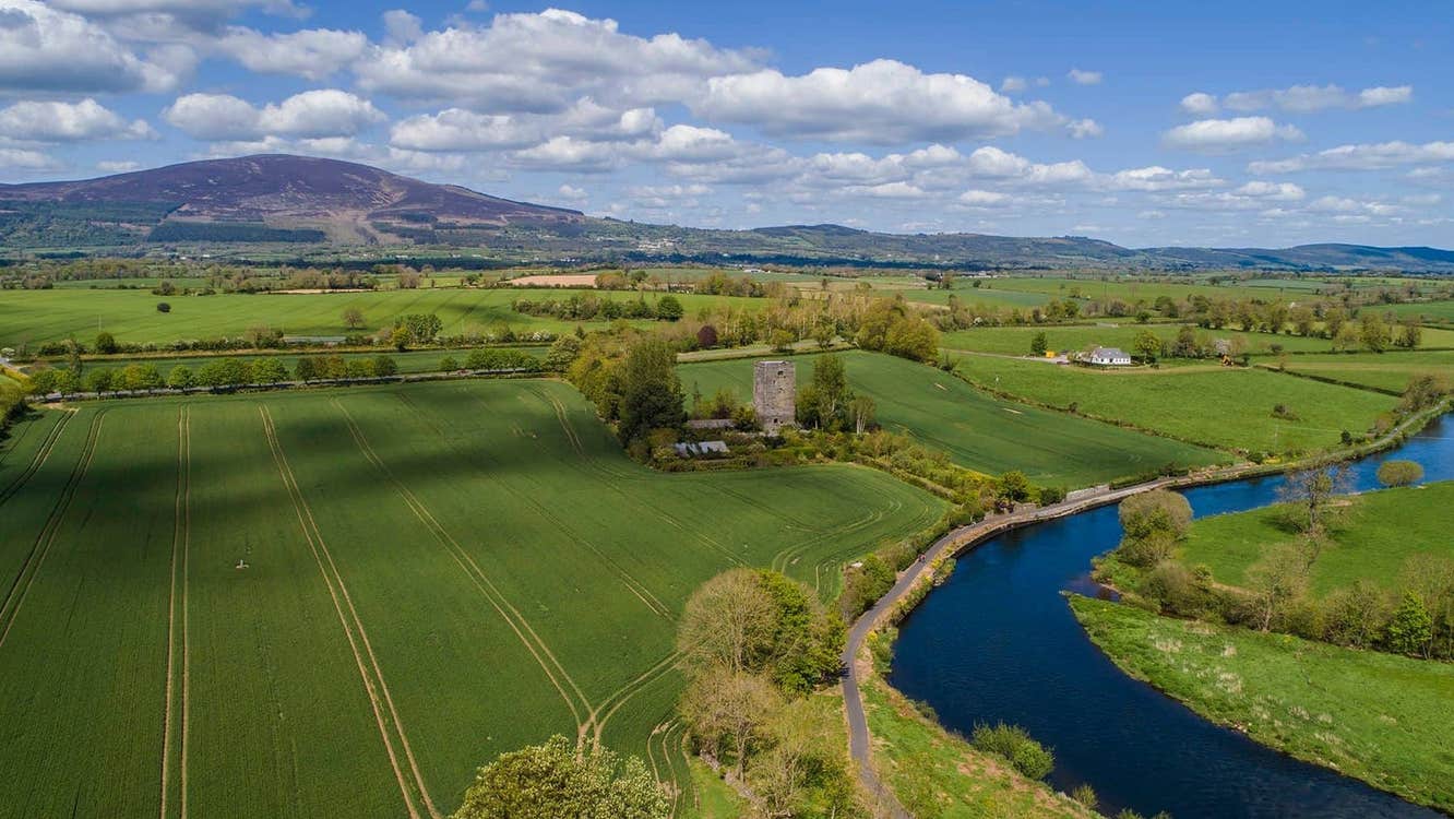 An aerial image a river winding through open fields