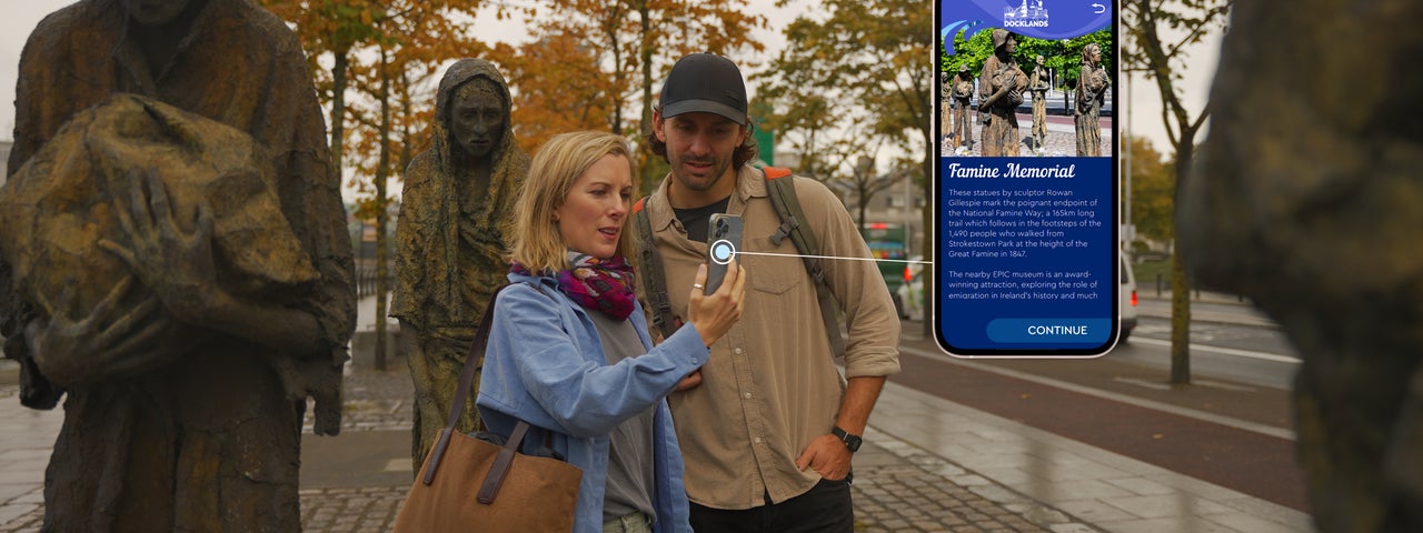 A couple using the app by the Famine Memorial in Dublin City