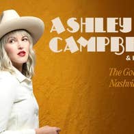 Side view of a woman dressed in white top, jacket and cowboy hat against dull orange background.