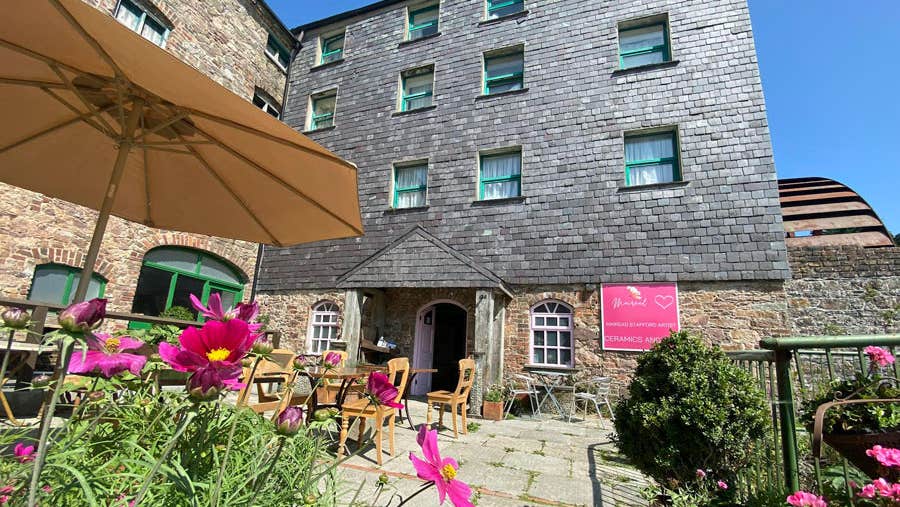 Image of outdoor patio area in front of old mill