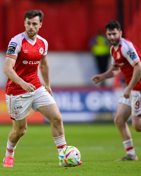 Jay features against Dundalk and stretches play with Aidan Keena in the background