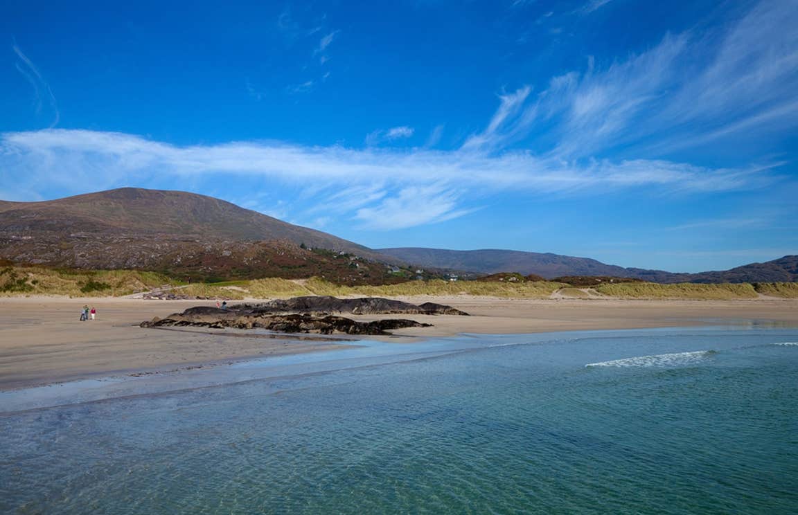 blue skies and a mountain backdrop at Derrynane Beach, Kerry