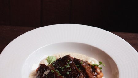 Main course of slow braised rib of beef served in the Eating Rooms at M.J. Wright