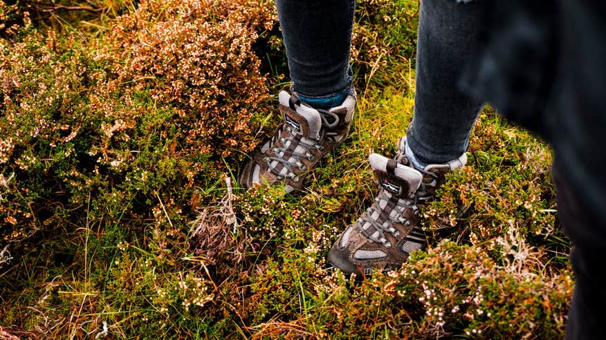 Hiking boots standing on leaves in Wild Nephin Ballycroy National Park