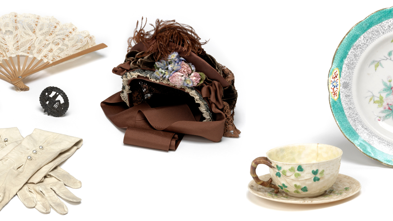 A selection of handling collection objects: lace fan, brooches, gloves, bonnet, teacup, and dish.