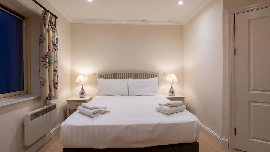 master bedroom with white linen