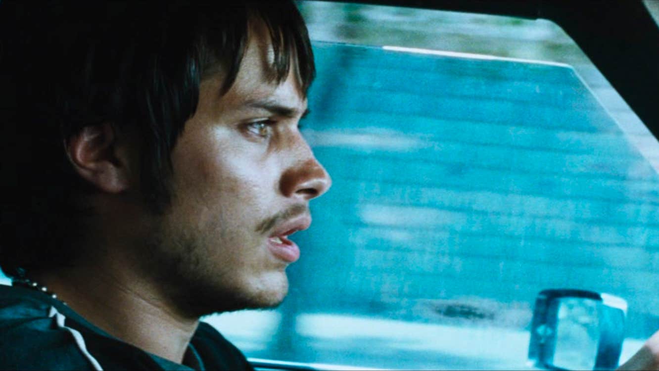 A worried man driving a car.