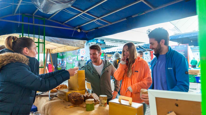 Friends tasting samples at the Milk Market.