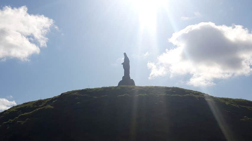 Knights and Conquests view of Motte and Bailey Castle with Saint Patrick statue