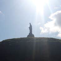 Knights and Conquests view of Motte and Bailey Castle with Saint Patrick statue