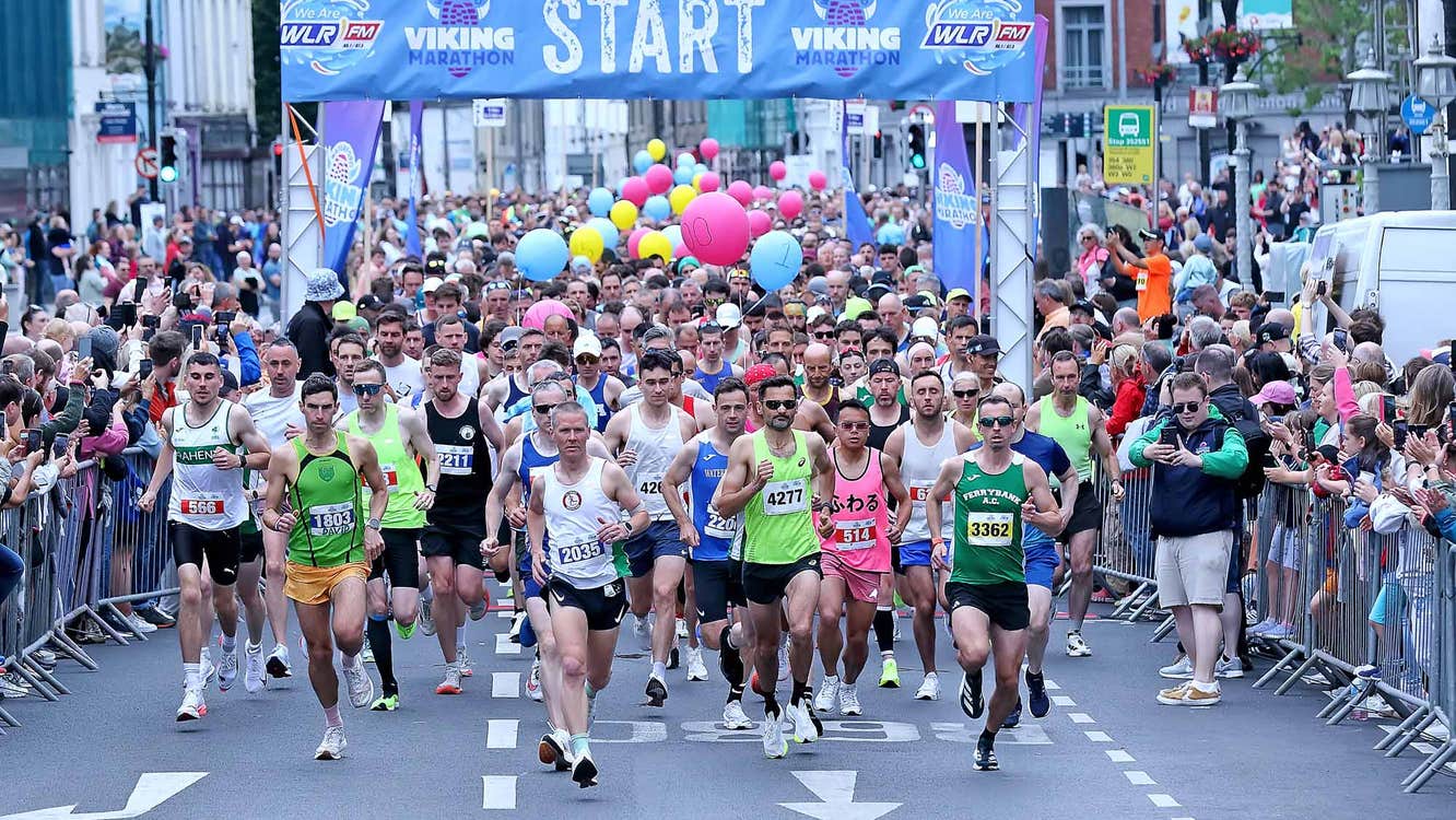 Waterford Viking Marathon 2026, lots of people running at the start of a marathon in a city.