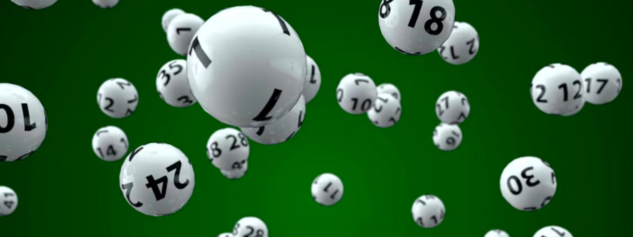 Lottery balls against a green background.
