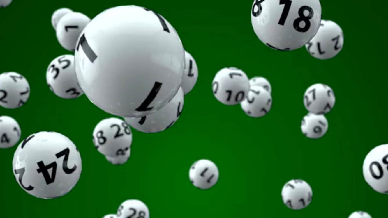 Lottery balls against a green background.