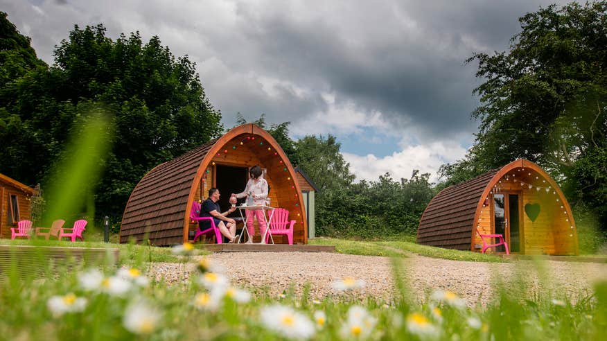 A couple outside a glamping pod at Pod Umna in County Galway