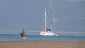 Image of horse rider and yacht in Lisfanon Beach