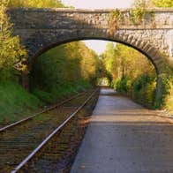 The greenway path which runs alongside the old railway tracks and an arch bridge