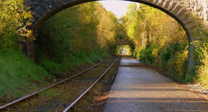 The greenway path which runs alongside the old railway tracks and an arch bridge