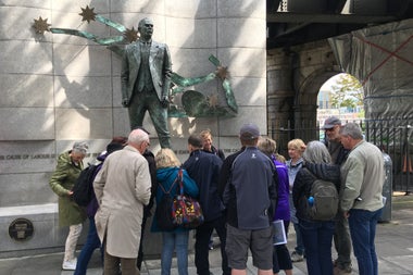 Group of people in front of a statue in Dublin City