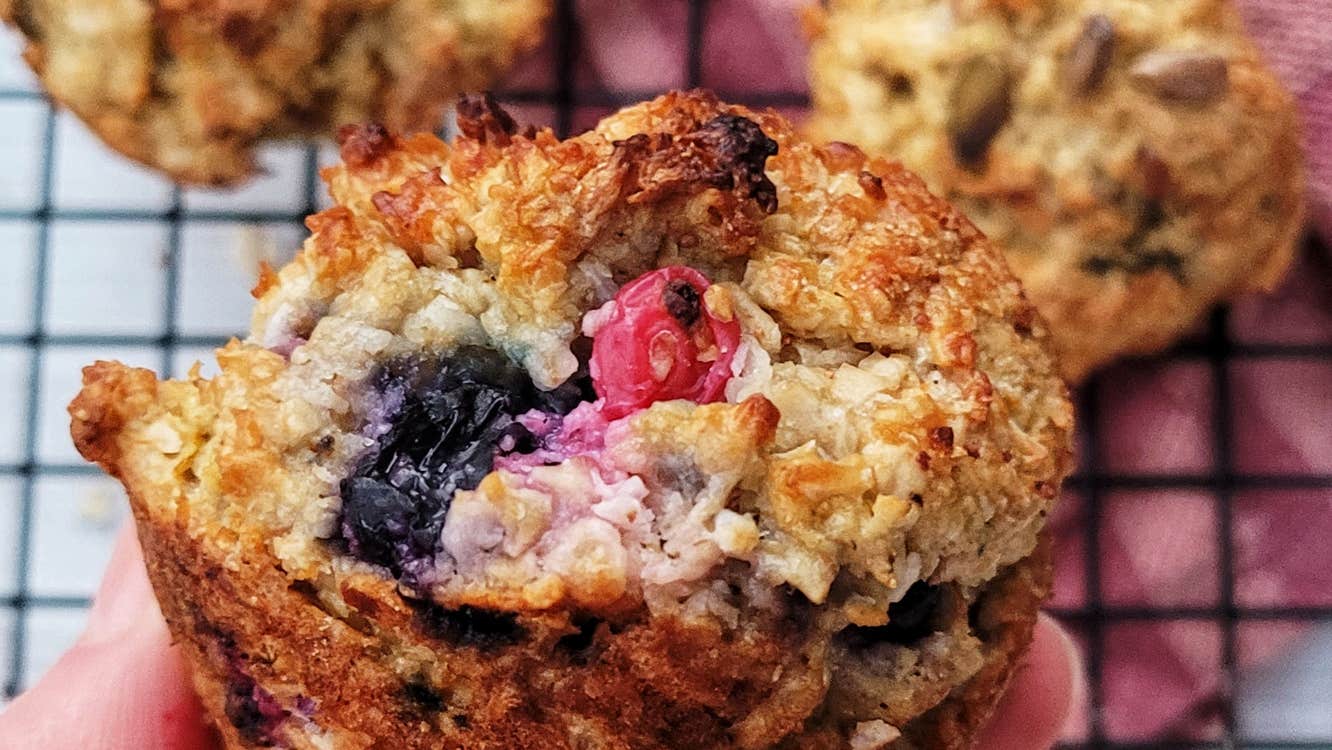 A hand holding a fruit scone