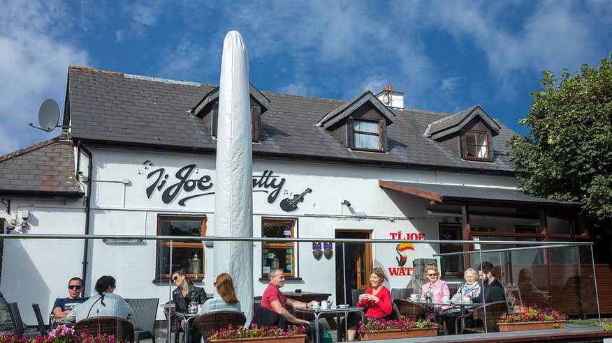 People having a drink outside Joe Watty's on the Aran Islands, Galway