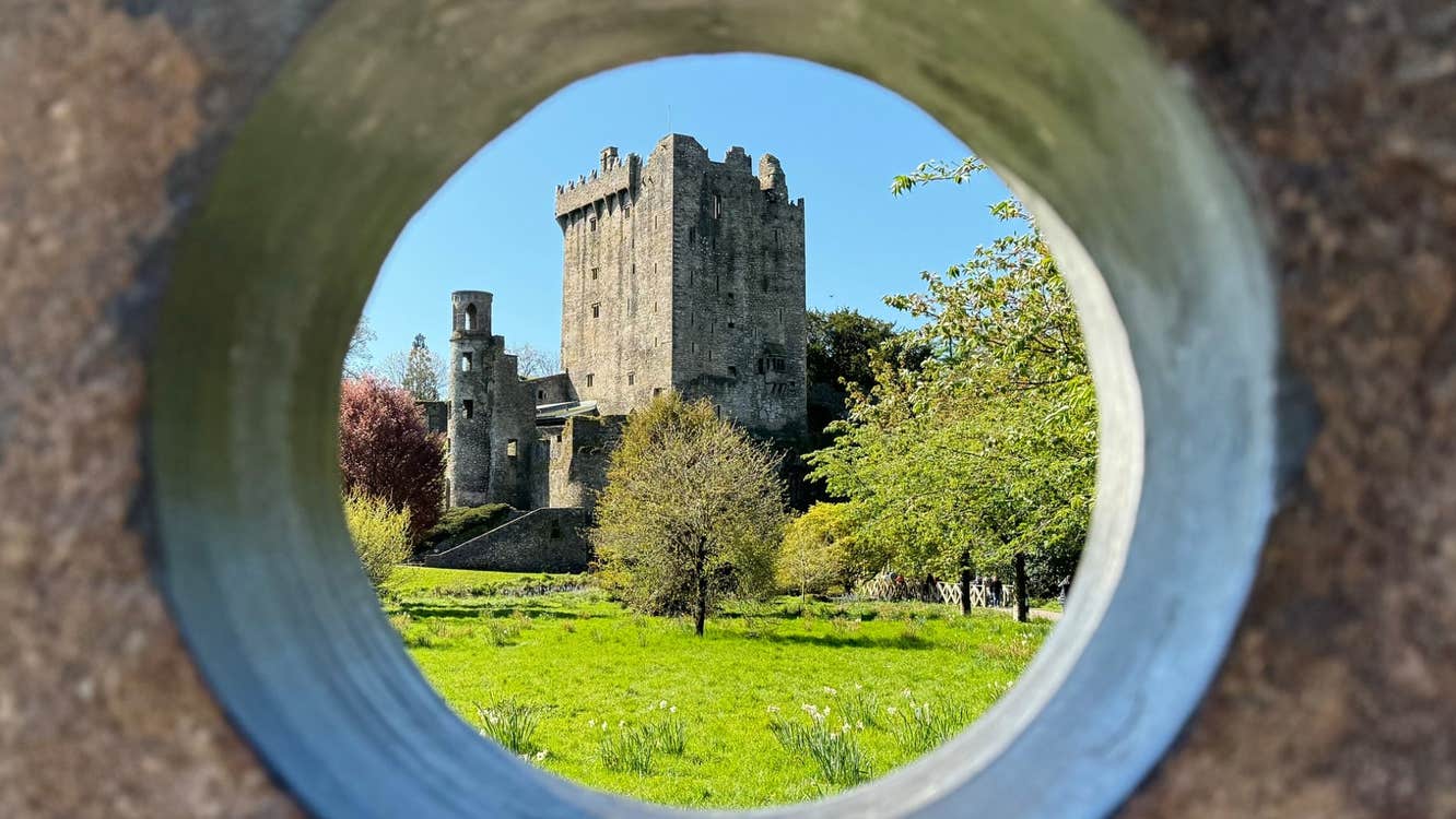 A view of a castle through a circular hole